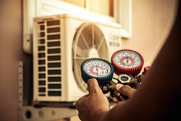 Professional Air Conditioning Service technician working in Arlington, WI